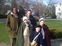 Lucky and a colonial family at the re-enactment in Lexington